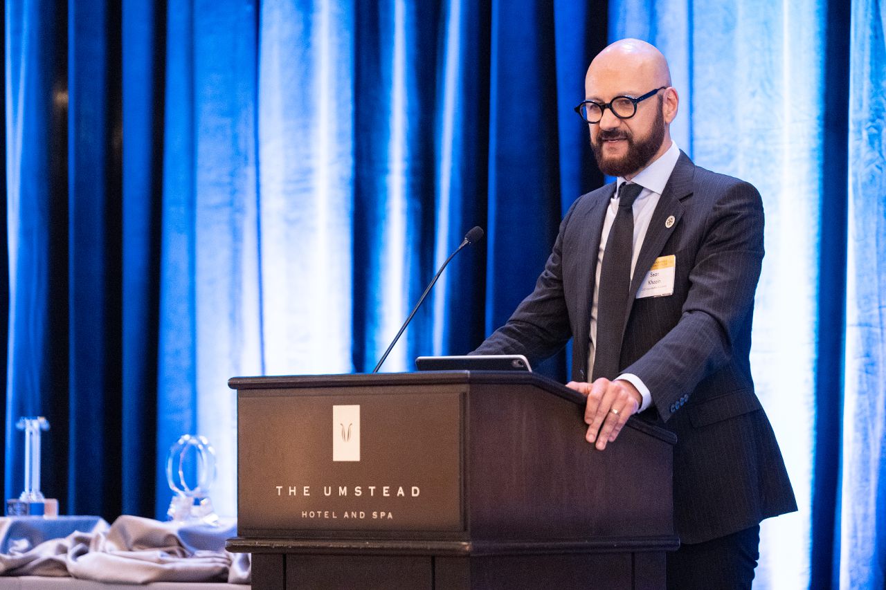 Dr. Khozin speaking at a podium